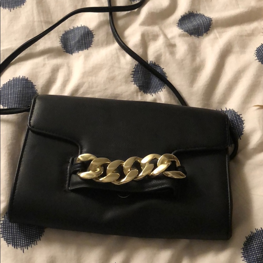 Metal detail hand clutch